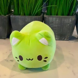 Green stuffed animal cat